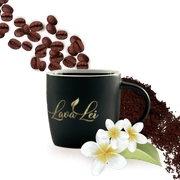 Coffee cup with the Lava Lei logo, set against a background of coffee beans and coffee powder.